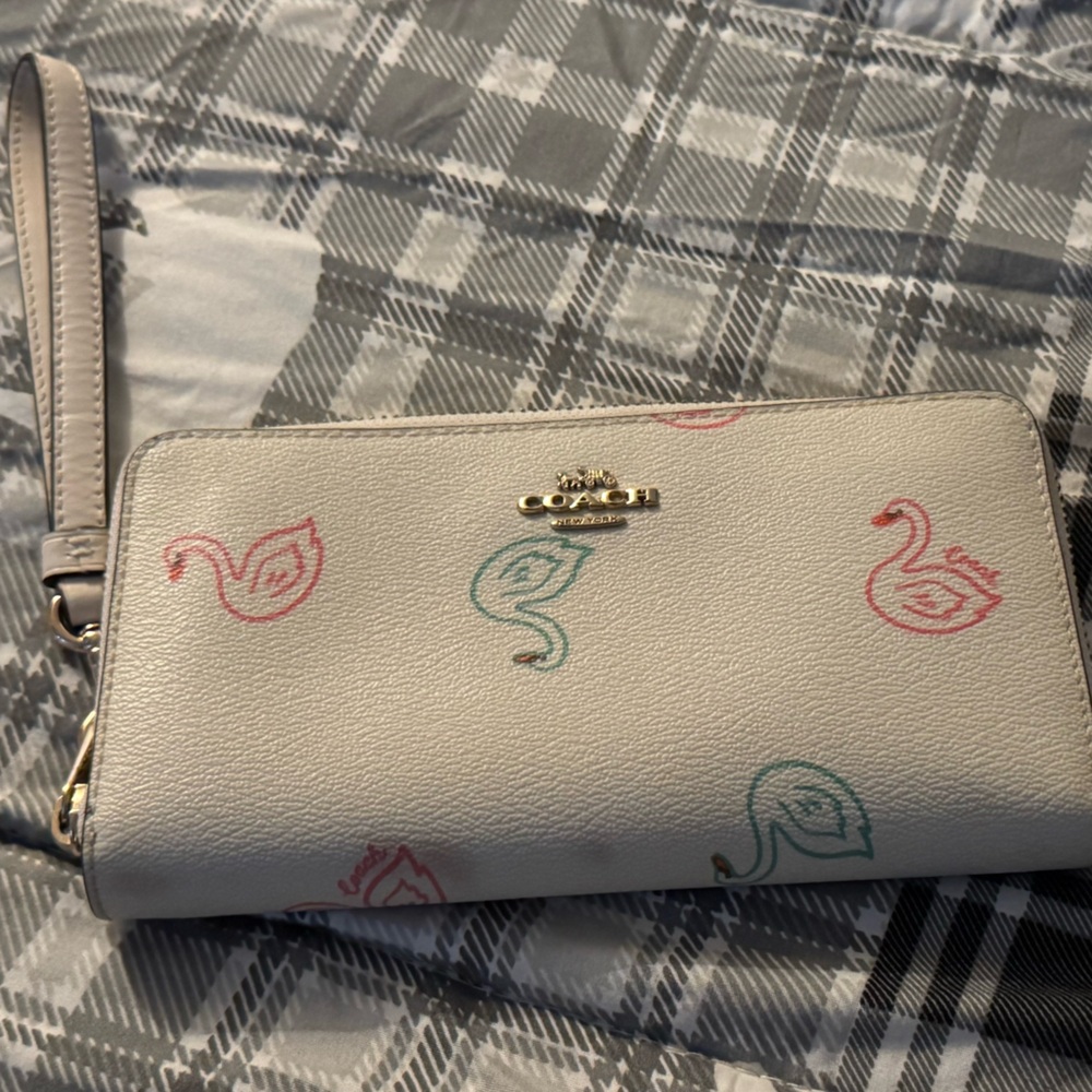 Coach Elegant Cream Wristlet with Multicolor Swan Accents